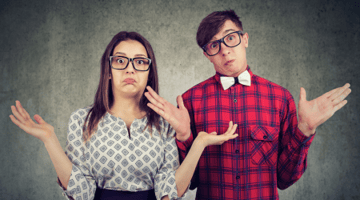 confused couple in dressy clothing