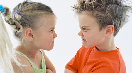 two kids in a face to face stand off