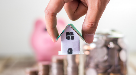 paper house with piggy bank